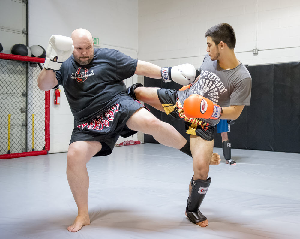 Absolute MMA Classes and Training in West Jordan, UT - Owner Rob Handley with Student