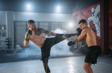 MMA fighter practicing by kickboxing.